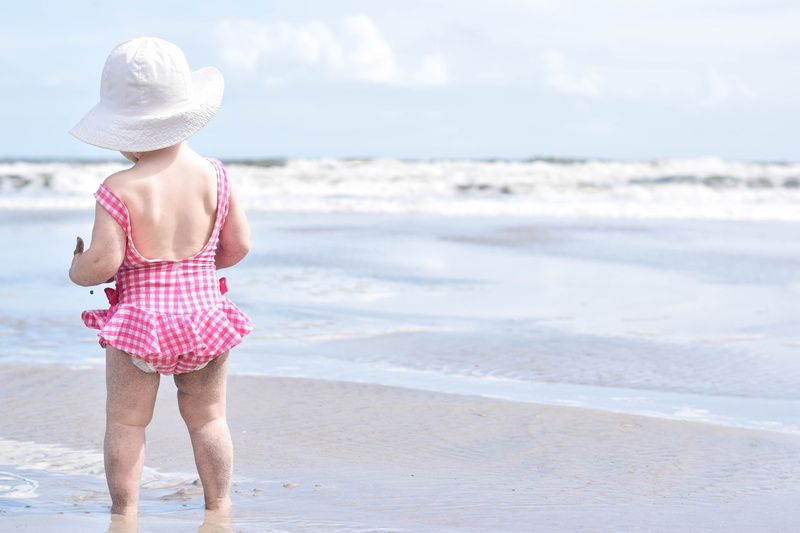 waves, outdoors, summer, innocence, trip, wave, sky, coast, red, hot, sun hat, girl, clothing, vacations, toddler, water, fashion, scenic, motion, shore