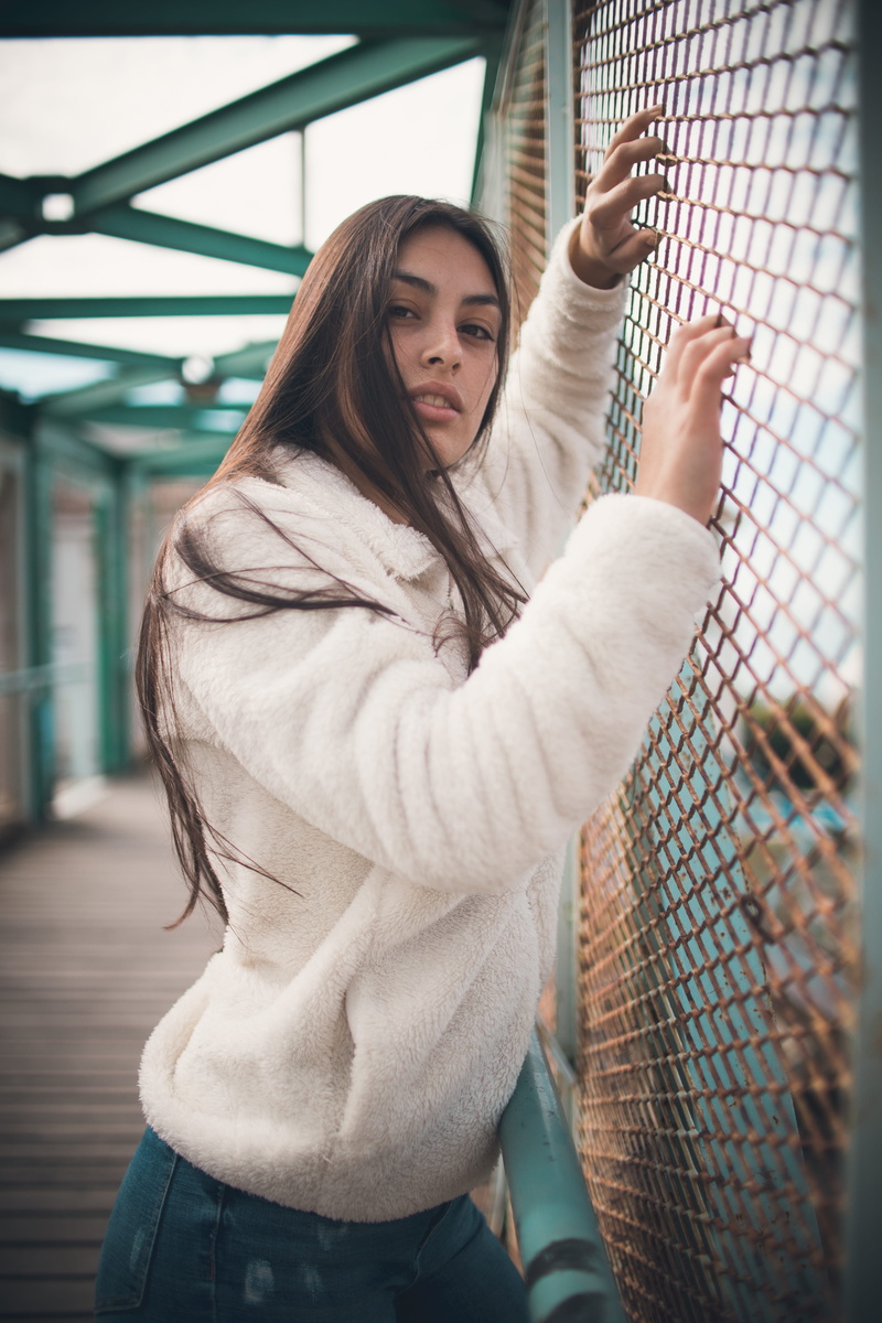human, female, wearing, long hair, looking at camera, day, young adult, person, clothing, young women, photography, beautiful woman, hairstyle, sweatshirt