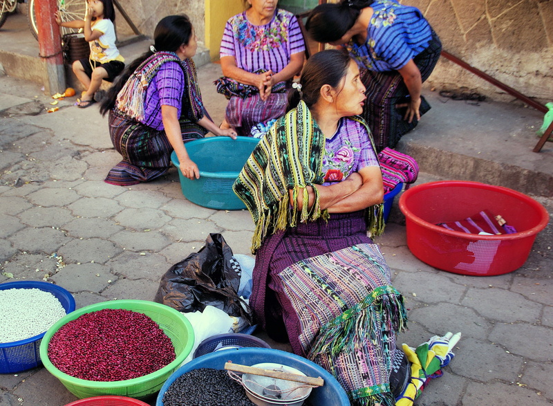outdoors, market, high angle view, lifestyles, retail, container, sitting, traditional costume, business, selling, men, food, saleswoman, peasant, guatemala