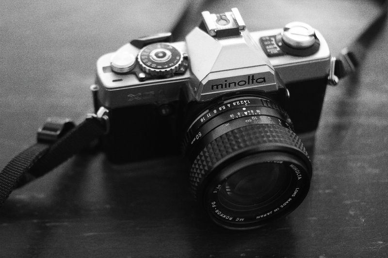 black, camera, table, black and white, monochrome, old fashion, camera gear, photographic equipment, vintage camera, emblem, single object, antique, home video camera