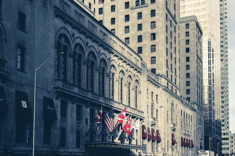 street, group of people, city life, 5K, day, women, people, building exterior, window, detail, office building exterior, real people, flag, lake, architecture