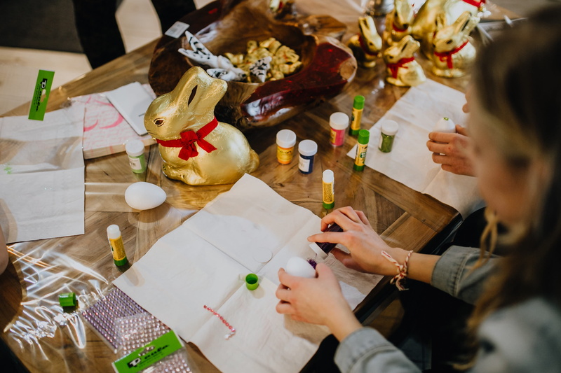 indoors, selective focus, coloring, business, diy, holding, human hand, table, painting, eggs, decoration, high angle view, food, easter eggs, people, lifestyles