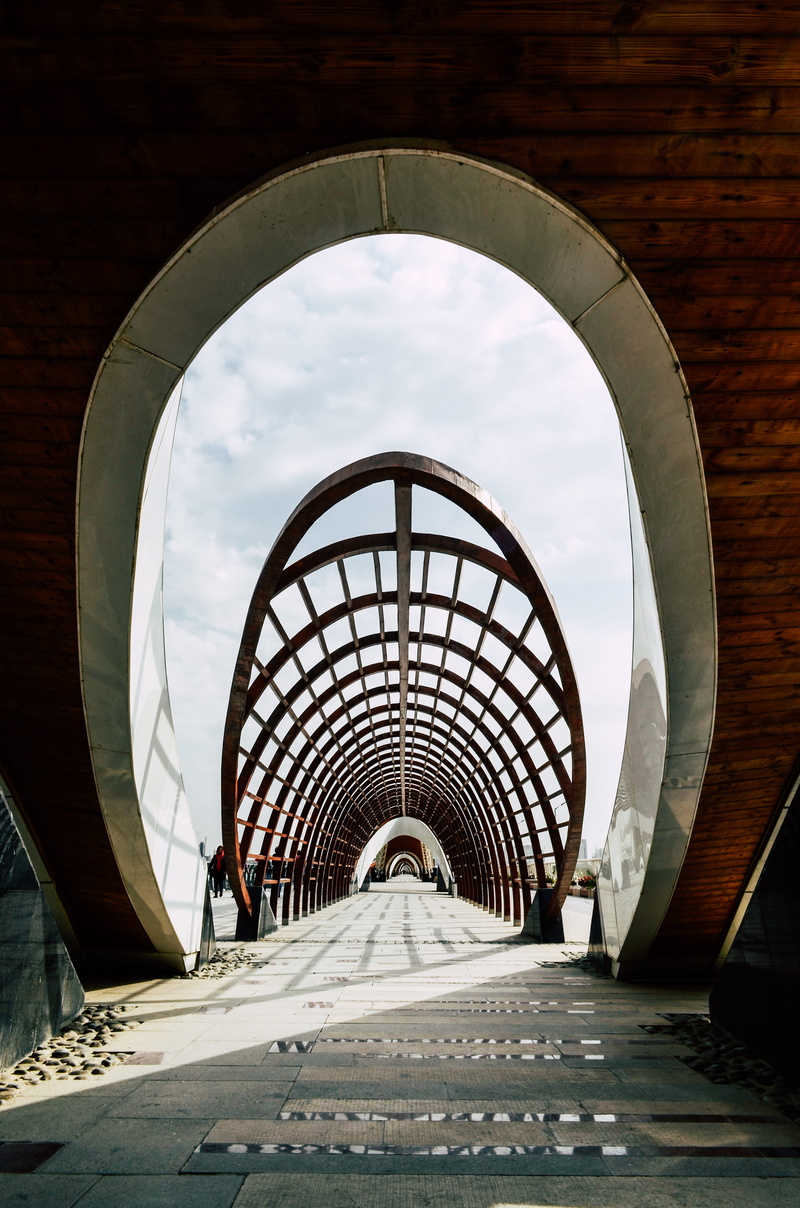 floor, city, built structure, bridge, banister, tunnel, path, fisheye, wood, no people, human, office building, corridor, arbour, garden, window, nature