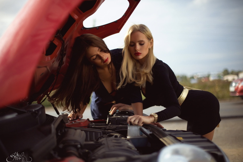 three quarter length, leisure activity, togetherness, black dress, young adult, red lipstick, lifestyles, adult, day, mode of transportation, photography