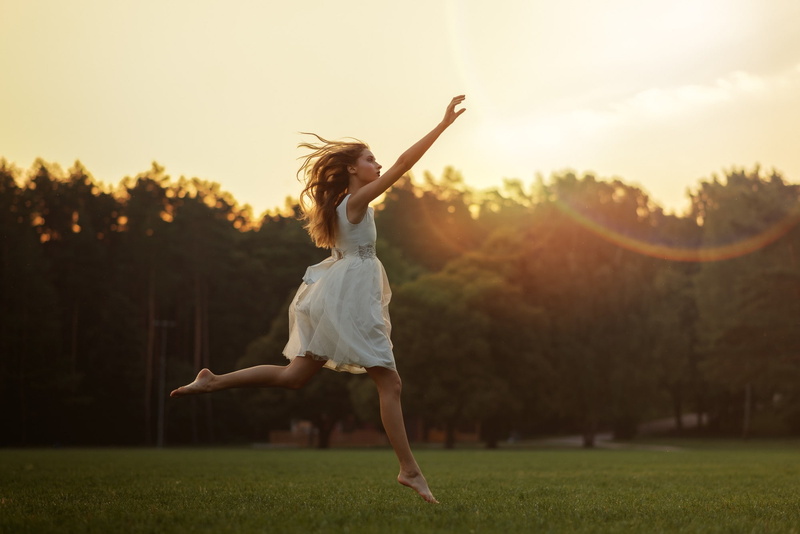 young adult, skill, one person, dancing, model, hairstyle, jumping, lens flare, body part, arms raised, human limb, mid-air, sunset, human arm, freedom