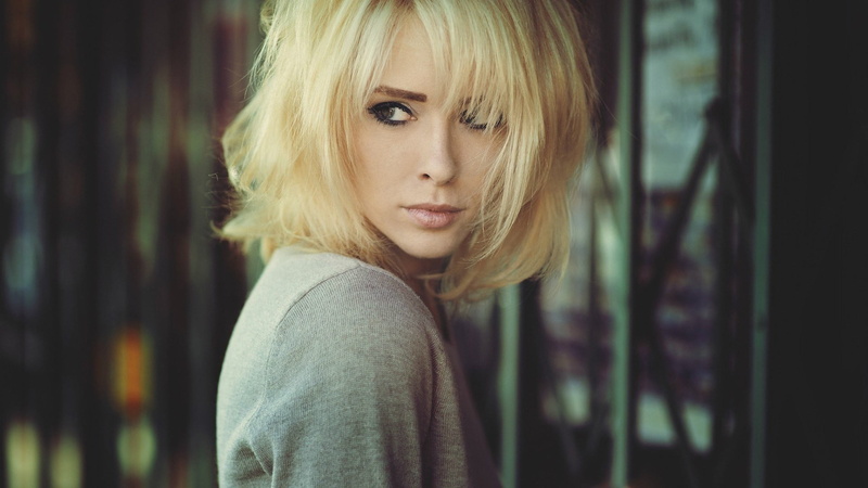 blond hair, focus on foreground, one person, Alysha Nett, portrait, beauty, looking at camera, standing, headshot, hairstyle, looking, gray, young women