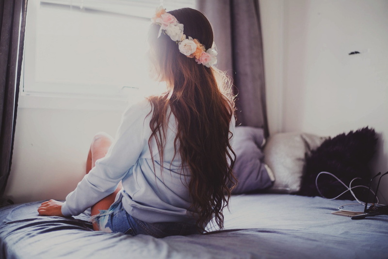 women, one person, young adult, cushions, indoors, full length, long hair, brunette, leisure activity, home interior, domestic room, sitting, lifestyles