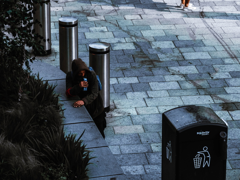leisure activity, man, homeless, trash, drink, person, outdoors, pottery, clothing, jar, human, grass, feather boa, real people, nature, one person, flora