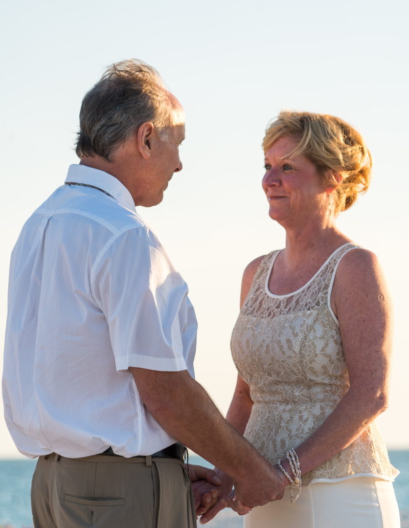 daytime, married, standing, holding, sand, senior women, women, groom, females, wedding, senior adult, romance, mature adult, couple - relationship, positive emotion