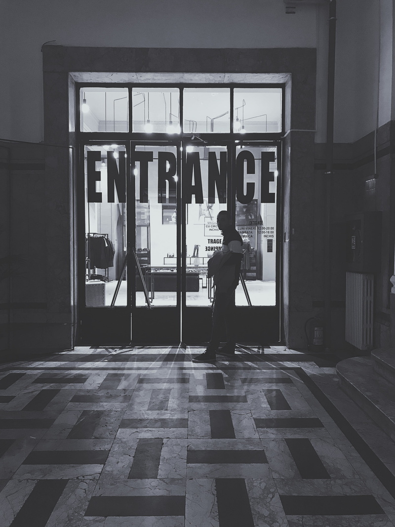 bucurești, door, one person, standing, architecture, near, human, entrance, full length, day, lifestyles, asphalt, built structure, young adult, urban