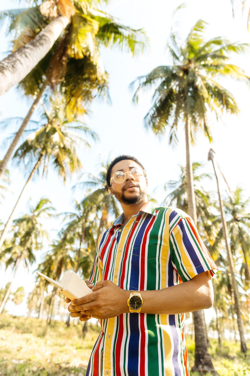 plant, near, one person, striped, young men, front view, lifestyles, low angle view, palm tree, shirt, tree, 5K, plam, young adult, outdoors, man, standing
