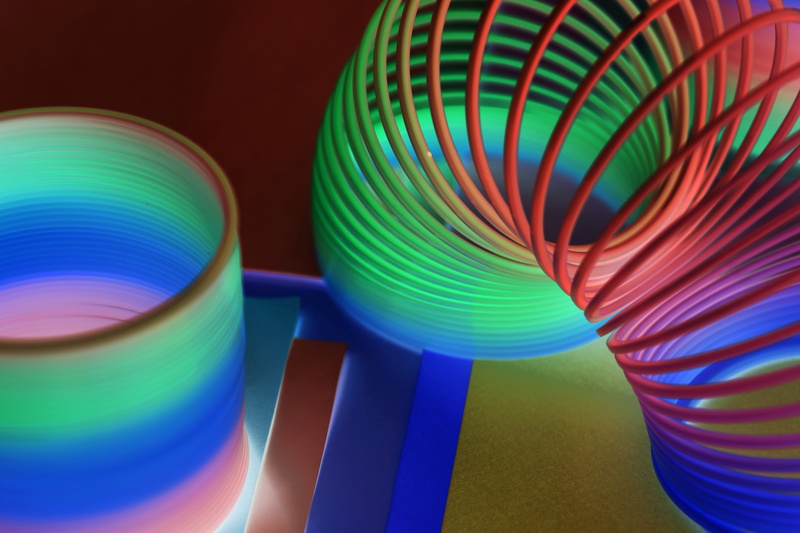 kids, long exposure, closeup, amusement, flexible, equipment, multi colored, game, striped, group of objects, 5K, enjoyment, blue, choice, black background