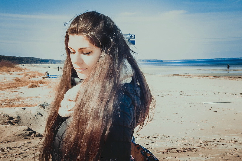 leisure activity, lifestyles, young adult, real people, water, outdoors, sand, hairstyle, dark hair, beauty in nature, sea, scenics - nature, beach, long hair