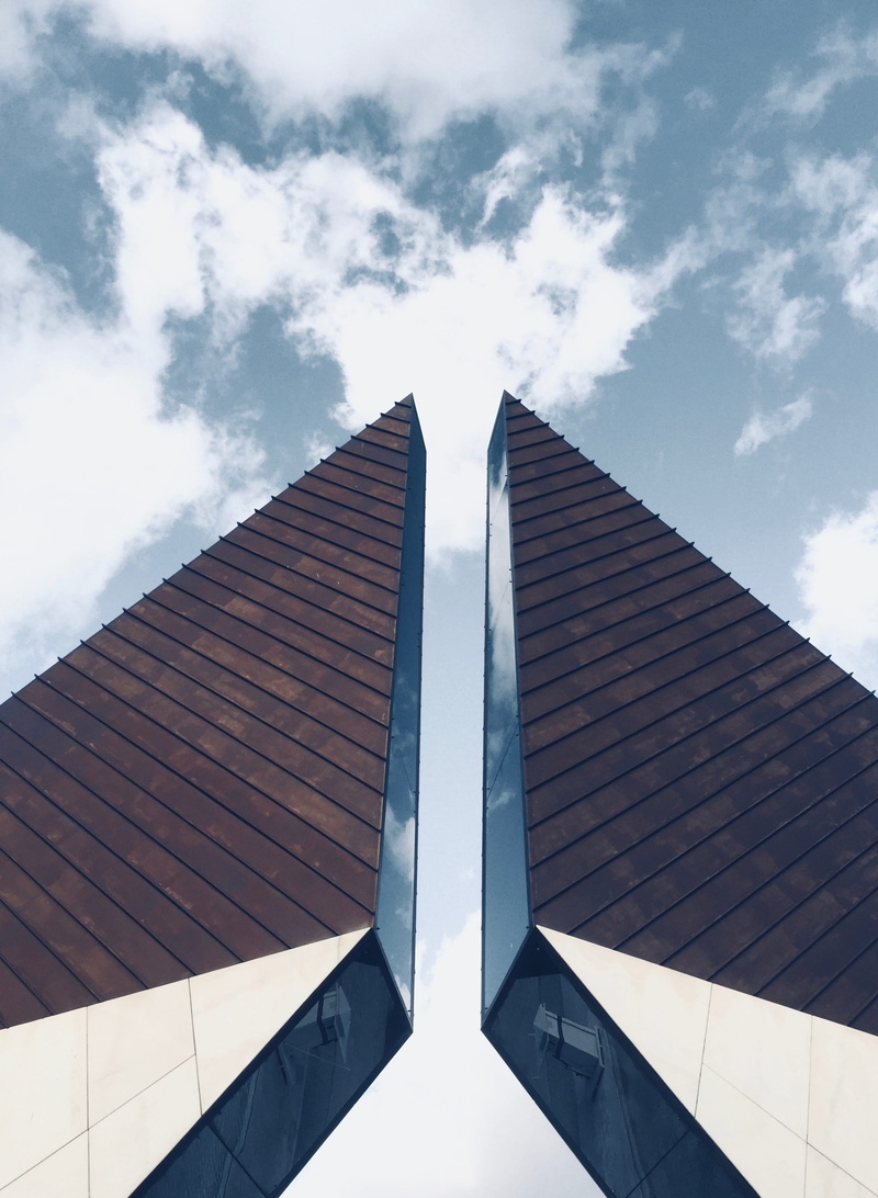 building, solar panels, white, tall - high, airplane, monument, war, cone, reflection, architecture, day, modern, spire, directly below, city, office building
