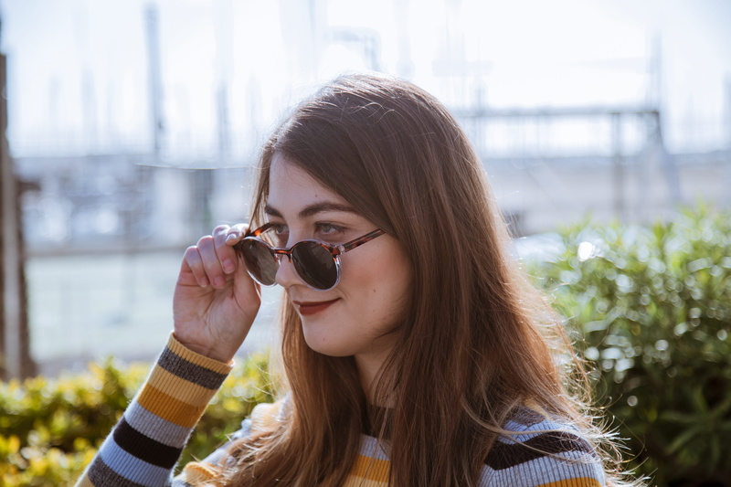 fashion, smiling, pretty, knitted sweater, leisure activity, blur, shades, 5K, brunette, day, sunglasses, holding, outdoors, wear, smile, close-up, hair