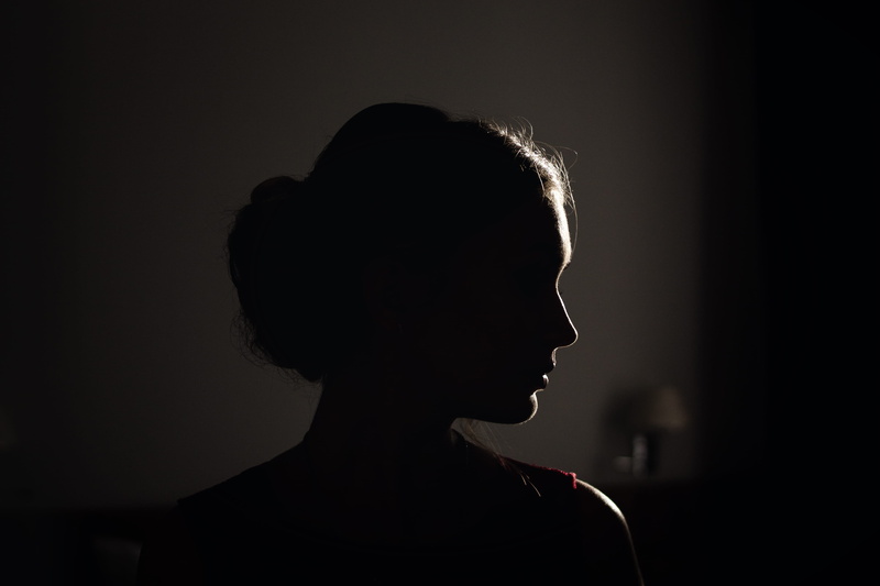 real people, flare, black background, side view, studio shot, adult, sunshine, profile view, dark, one person, contemplation, light, hair, young adult