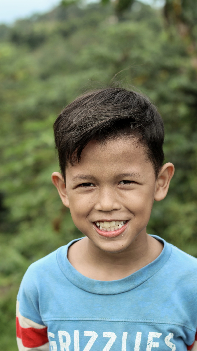 focus on foreground, front view, 5K, males, men, happy, outdoors, casual clothing, portrait, day, looking at camera, innocence, kind, potrait, one person
