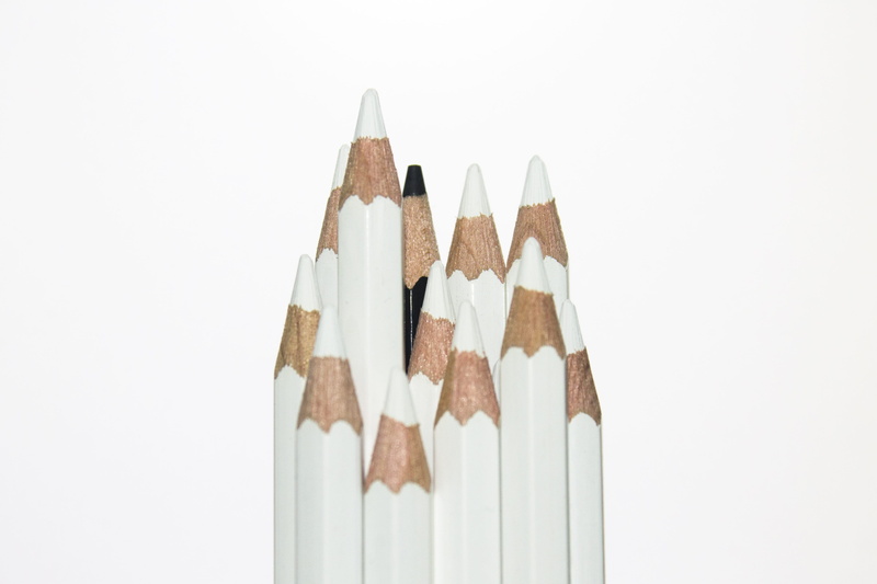 white, photography, indoors, pencil, discrimination, craft, simplicity, cut out, colored pencil, art and craft equipment, close-up, racism, black, group of objects