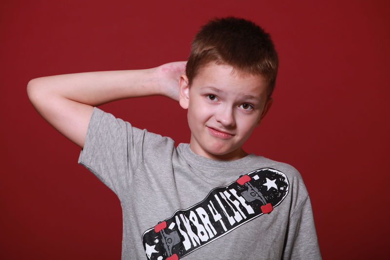 thinking, boys, indoors, front view, text, red, studio shot, pre-adolescent child, childhood, adolescence, got to thinking, one person, red background