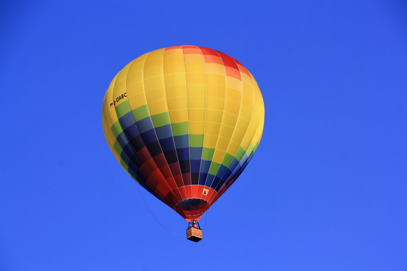balloon envelope, clear sky, no people, freedom, balloon, day, mode of transportation, multi colored, sleeve, nature, rising, air, wind direction, copy space