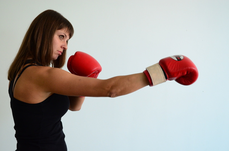 studio shot, copy space, strength, gloves, hairstyle, ring, strong, healthy lifestyle, room, sports training, young adult, aggression, sports, sport, wearing