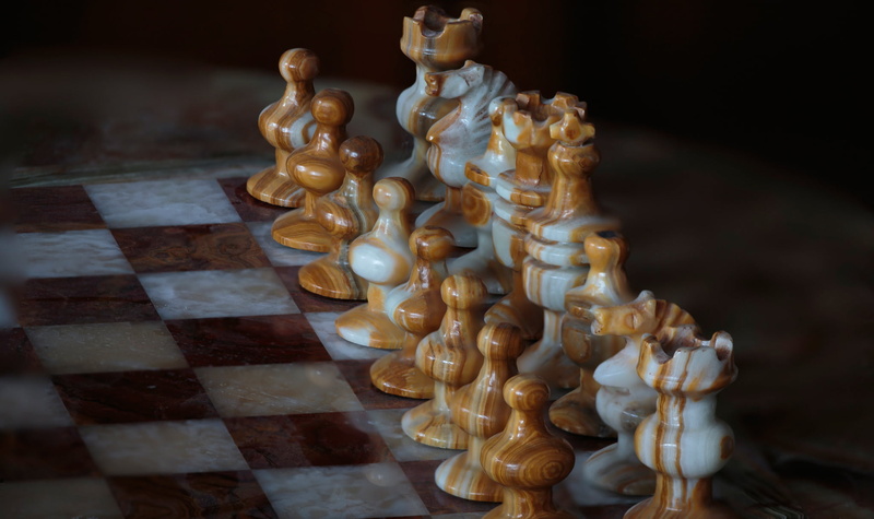 human representation, sculpture, chess piece, antique, the game, figure, leisure games, chess, statue, indoors, high angle view, Board, craft, board game