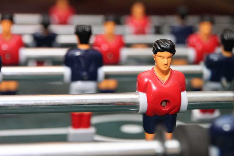 muscular build, vitality, athlete, indoors, adult, competitive sport, football, table, figurine, sport, young adult, men, selective focus, activity, strength