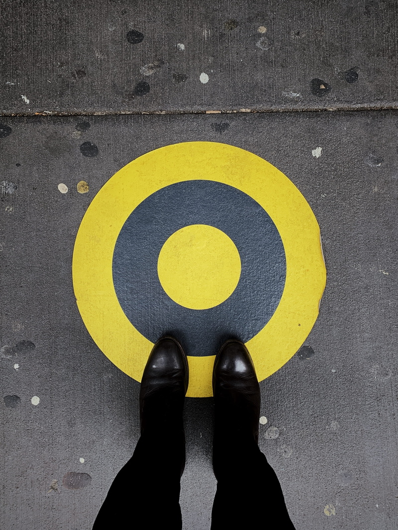 human limb, goals, human body part, symbol, 2K, yellow, shoe, ambition, target, human foot, transportation, standing, communication, street, one person