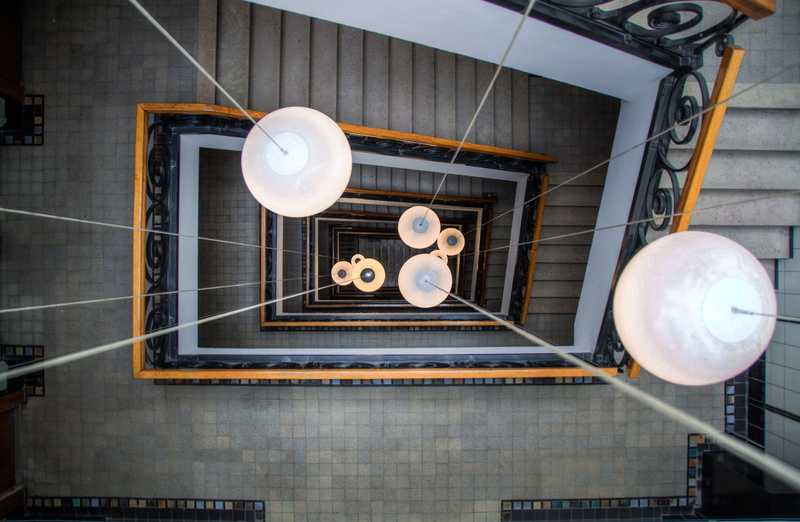 architecture, hanging, day, stairs, directly above, electricity, arts culture and entertainment, balloon, business, low angle view, floor, pendant light