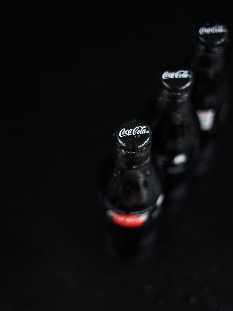 indoors, seasoning, still life, glass, studio shot, selective focus, three, cola, bottle, black background, 5K, coca, bottles, simplicity, black color