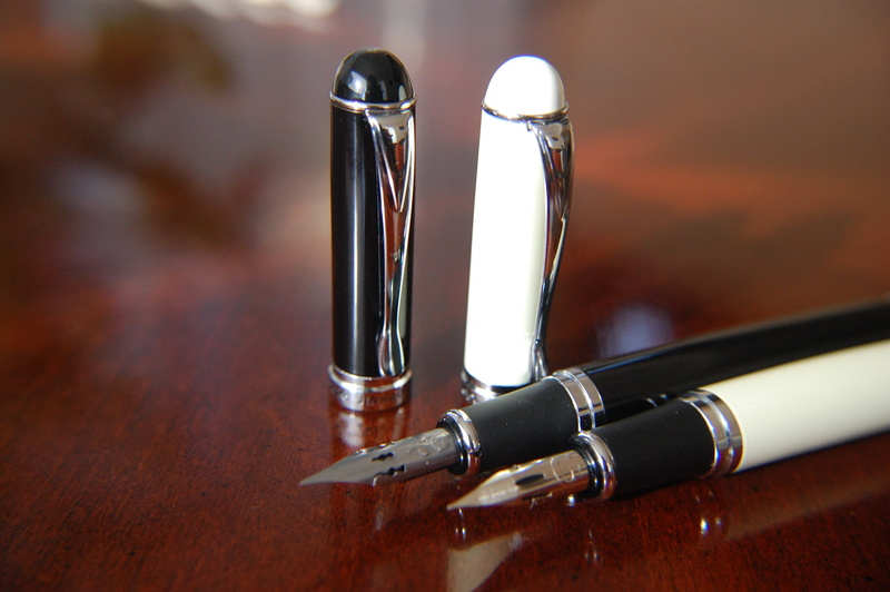 food and drink, stationery, handwriting, nib, signature, office, wood - material, social issues, document, writing instrument, salt shaker, two objects