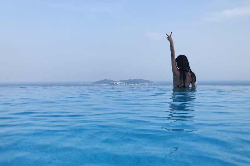 horizon over water, holiday, china, sky, swimming, sea, adult, waterfront, swimming pool, 2K, arms raised, trip, rosewood, nature, real people, women