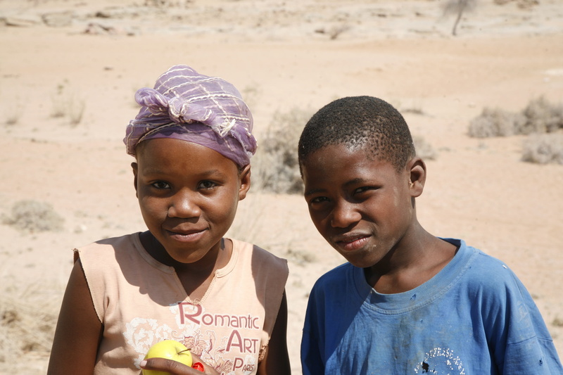 african Culture, childhood, real people, sand, boy, front view, land, africa, looking at camera, lifestyles, boys, african Ethnicity, portrait, photography