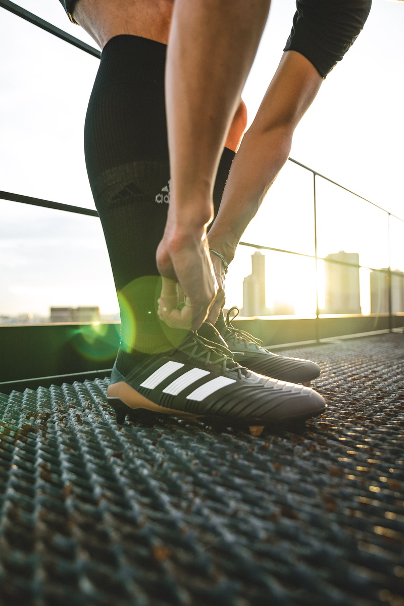 day, boots, sport, selective focus, sports shoe, cleats, human leg, football, body part, white, holding, man, low section, adult, real people, adidas, male