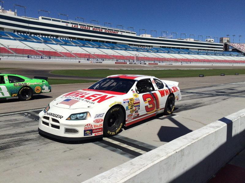 built structure, Speed, architecture, race, motor vehicle, flag, outdoors, motorsport, competition, car, text, road, land vehicle, auto racing, sports track
