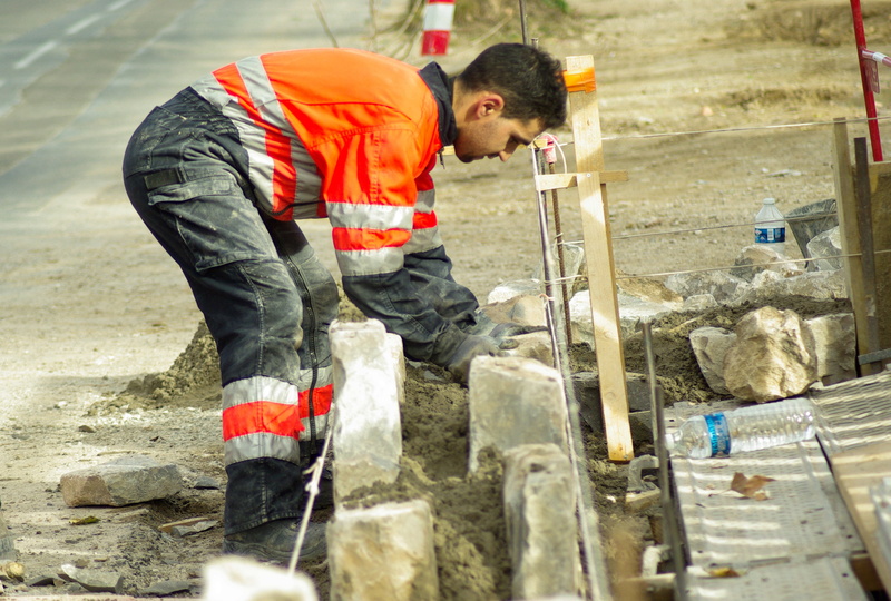 one person, men, road construction, protection, bending, safety, industry, worker, people, occupation, building - Activity, construction Industry, working
