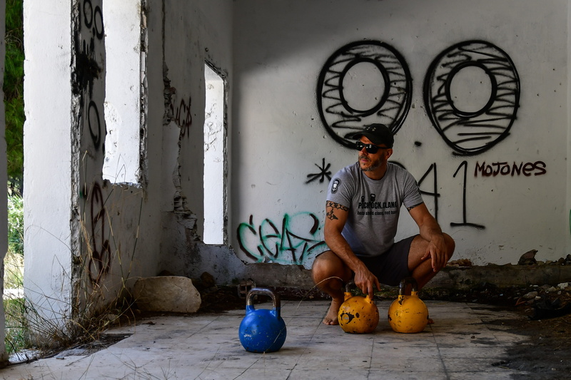 window, day, 2K, food and drink, lifestyles, holding, kettle bell, built structure, taco fleur, one person, wall - building feature, casual clothing, grunge