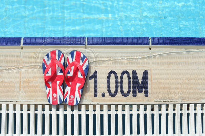 text, outdoors, pair, sight, flag, pool, poolside, no people, flops, water, sandal, red, jack, beside, 5K, swimming, black, summer, flip flop, flipflop