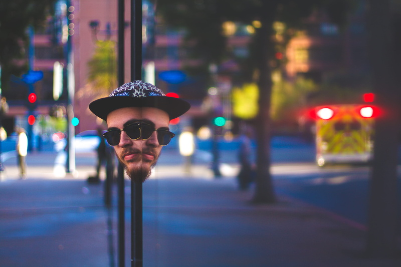 glasses, incidental people, architecture, 4K, street, city life, night, security, one person, hat, light, reflection, lights, city street, focus on foreground