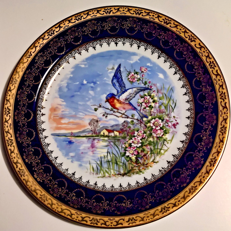 studio shot, rand in cobalt blue and gold, creativity, design, Hand, close-up, gold decorated, art and craft, beauty in nature, Plate, still life, flowering plant