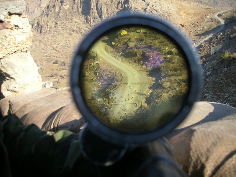 720P, close-up, transparent, sniper rifle, magnifying glass, sunlight, glass - material, geometric shape, finger, outdoors, circle, reflection, one person