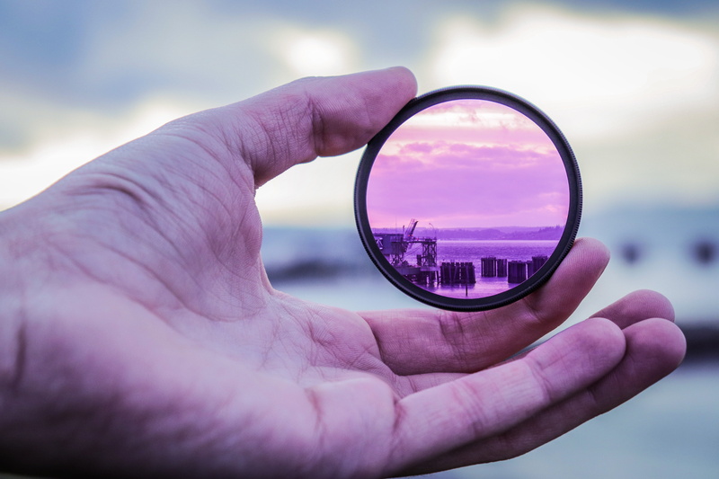 human body part, outdoors, lens, human hand, looking through an object, 5K, magnifying glass, lens - optical instrument, body part, cloud - sky, one person