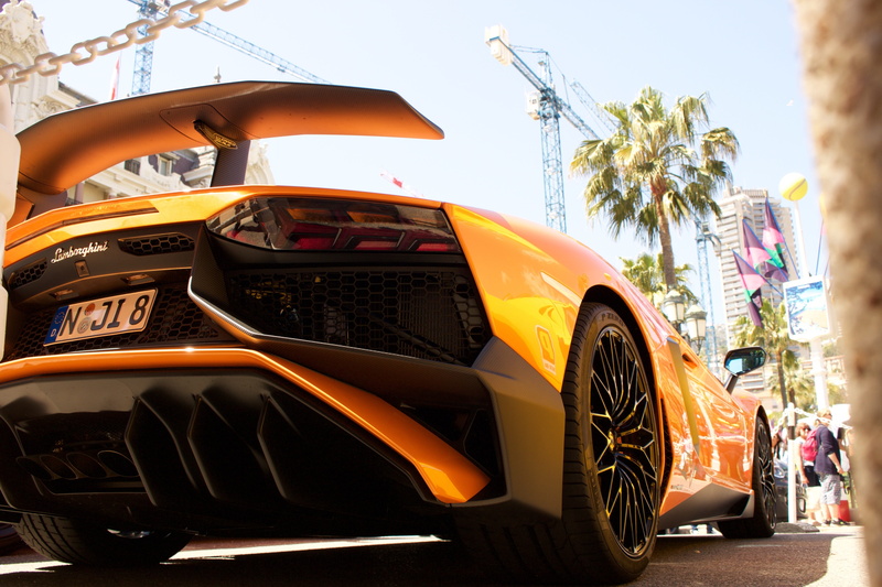 building, land vehicle, mode of transportation, summer, vehicle, engine, aventador, road, french riviera, text, outdoors, hurry, transportation system
