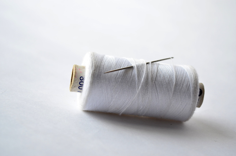 sewing, needle, tailoring, thread, indoors, wool, spool, still life, no people, stitch, creativity, textile, art and craft, needlework, craft, fabric, white