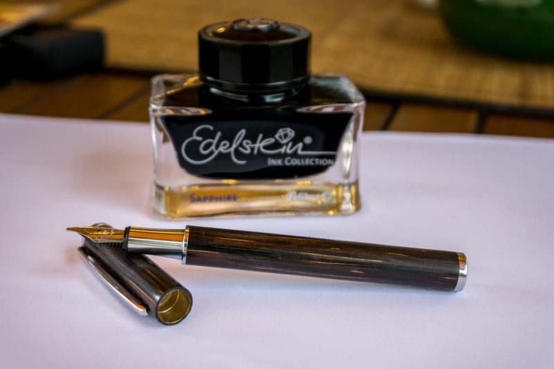 blue, handwritten, no people, gold colored, feather, nostalgic, fountain pens, letters, calligraphy, fountain pen, ink, wood - material, bottle, high angle view