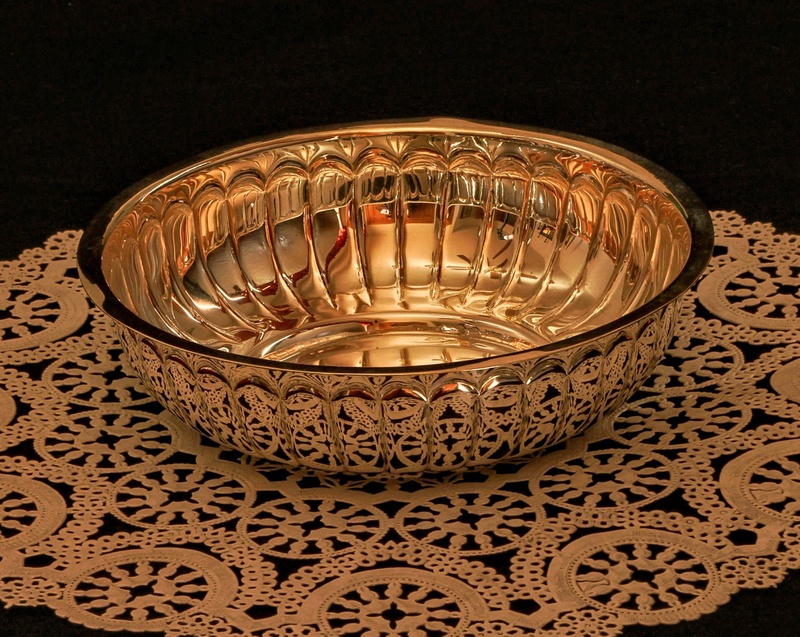 electric lamp, table, tea light, illuminated, indoors, candle, gold, vermeil, silver, black background, ornate, pattern, dish, cultures, lighting equipment
