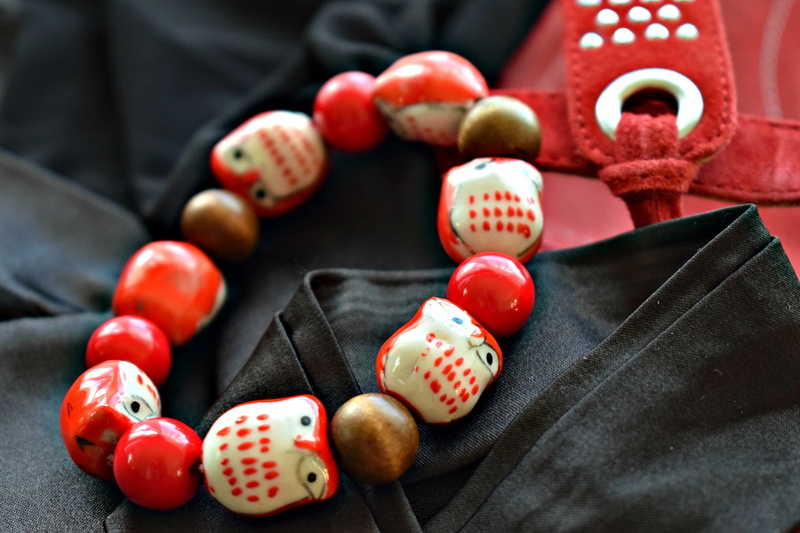 holding, macro, red, clothing, red and black, focus on foreground, pearls, red shoes, traditional clothing, black doily, jewelry, close-up, celebration