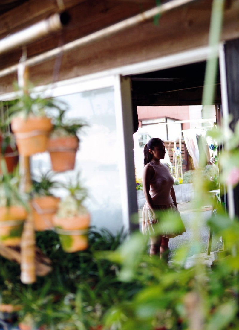 one person, sleeveless, architecture, dress, standing, gardening, young adult, plant, outdoors, three quarter length, built structure, potted plant, s
