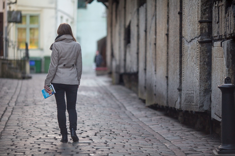 book, lifestyles, full length, casual clothing, female, street, city, blue, outdoors, one person, road, europe, real people, built structure, explore, building exterior
