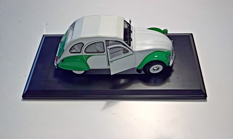 environmental conservation, car, still life, green color, high angle view, studio shot, no people, cult car, many parts that open, 2 Cv, white background